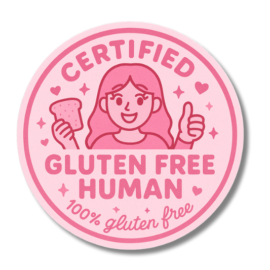 Pink "Certified Gluten Free Human" vinyl sticker featuring a cartoon girl holding gluten free toast and giving a thumbs up